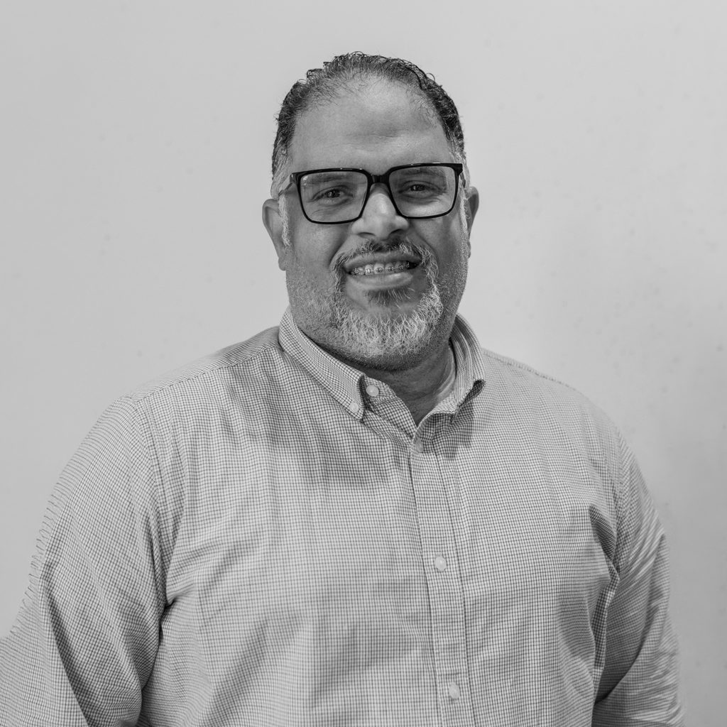 Black and white portrait of Carlos Rodríguez, from the Grafiks sales department